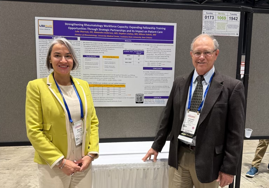 Two conference attendees stand beside a research poster displayed at a poster session during ACR Convergence. The poster is mounted on a presentation board, and both attendees wear conference badges.