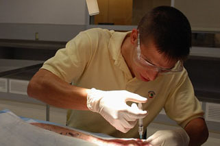 Science and Practice of Medicine 200: Clinical Skills Lab - 2nd Year Medical Students performing local anesthetic on cadaveric specimens