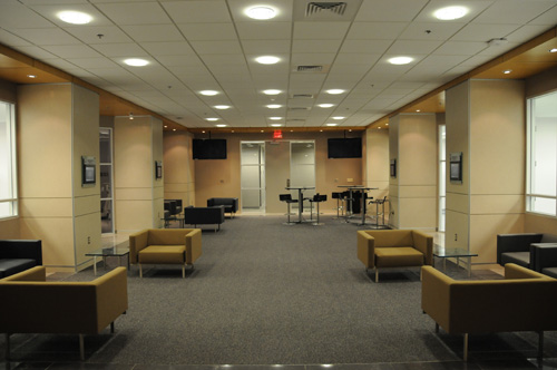 The lounge area in the Center for Advanced Practice overlooks the simulation rooms 