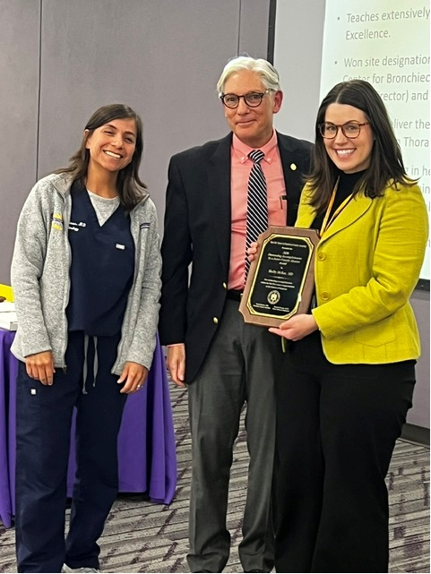 Dr. MacRae accepts award.