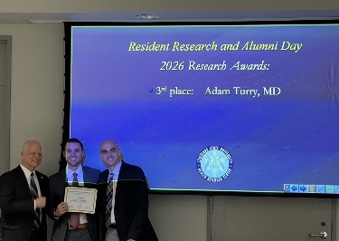 Dr. Adam Turry accepts award.