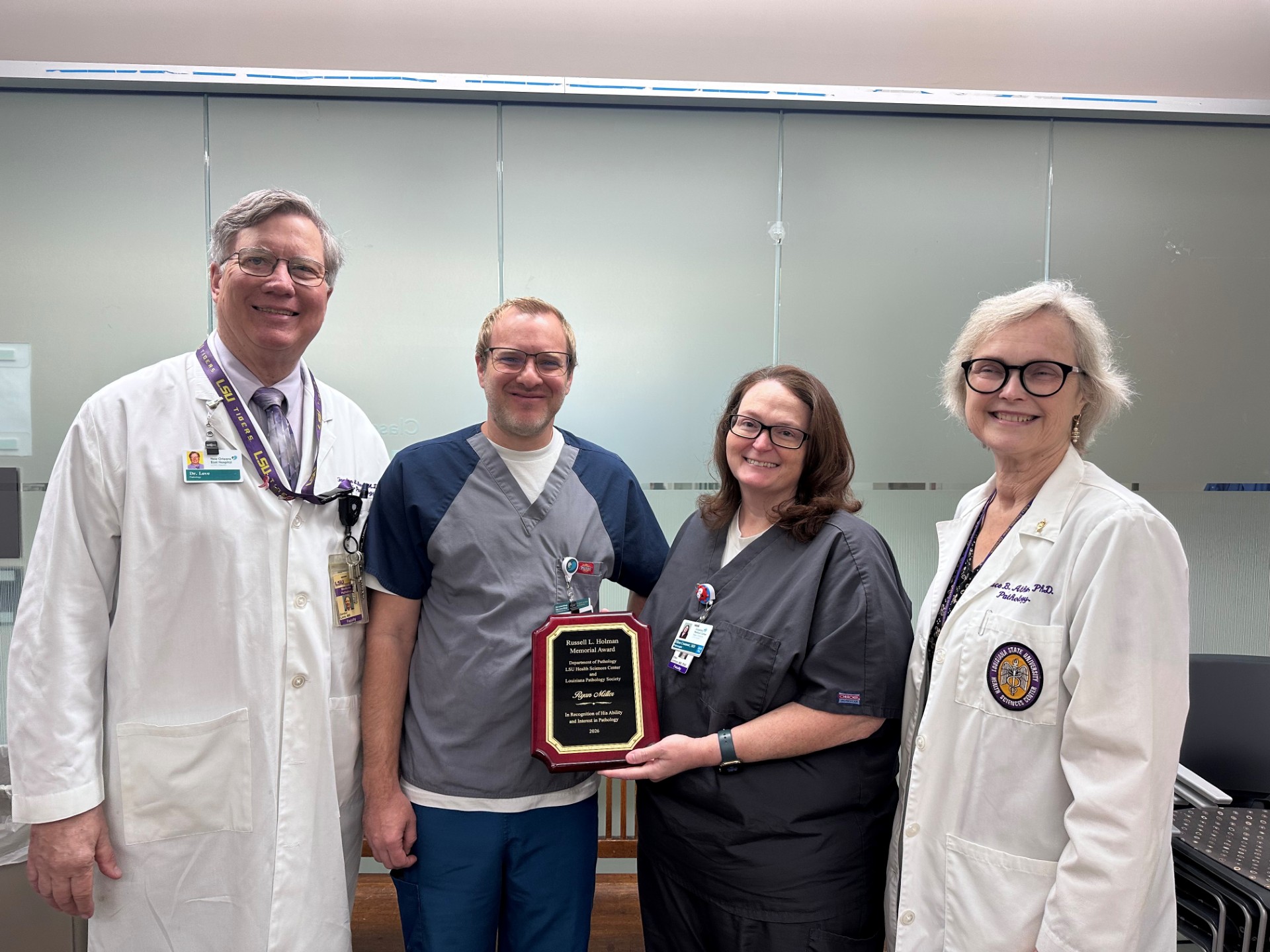 Dr. Ryan Miller accepts award.