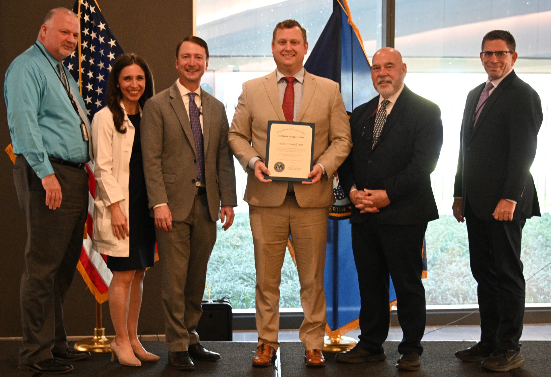 Dr. Woodall accepts award