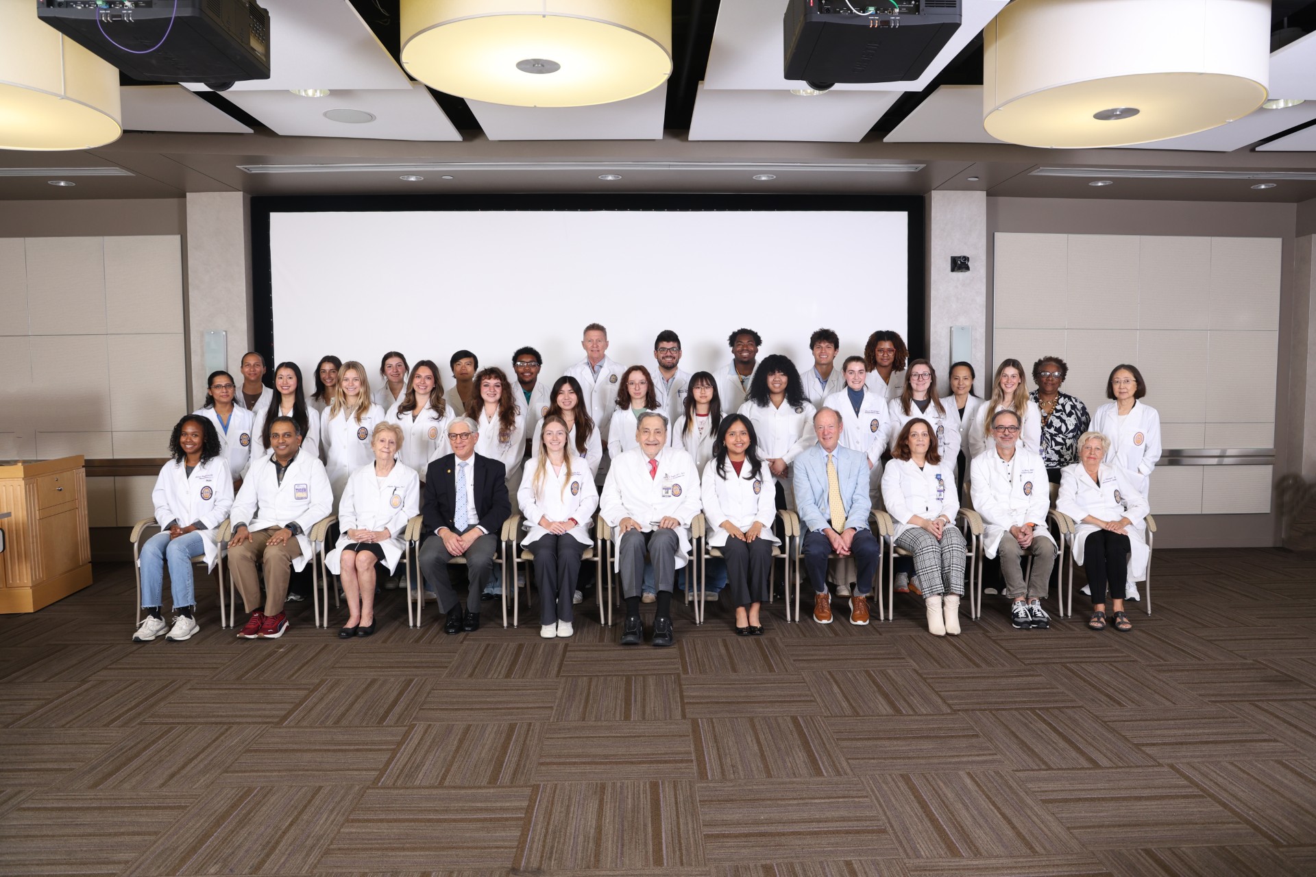 SUN students pose with Dr. Bazan and other faculty
