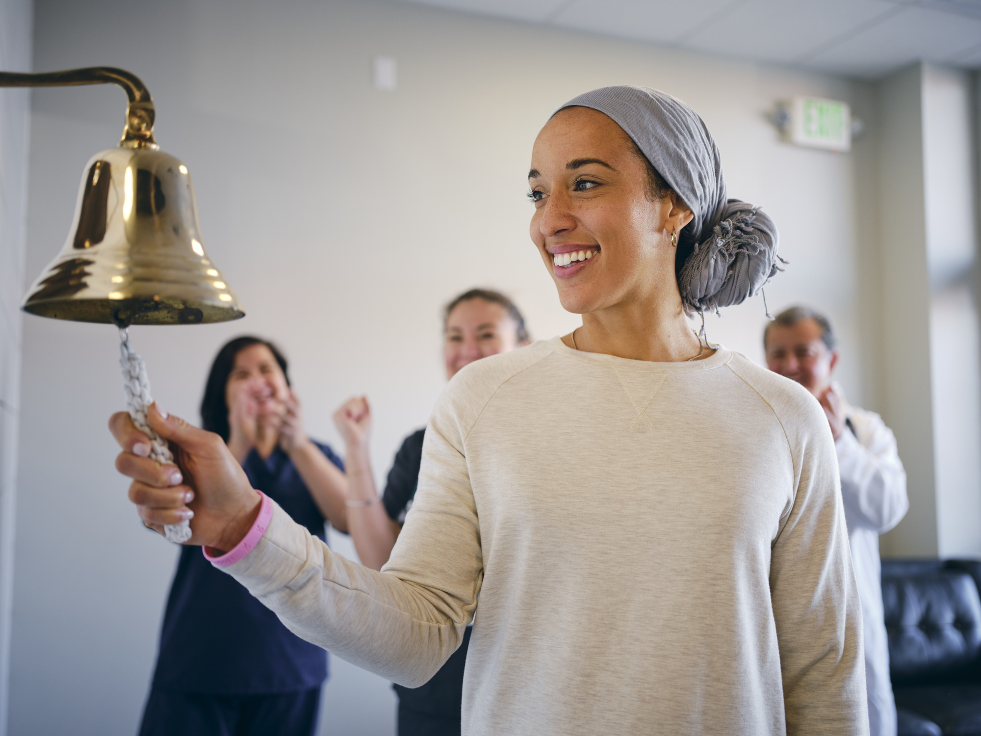 Survivor ringing a bell