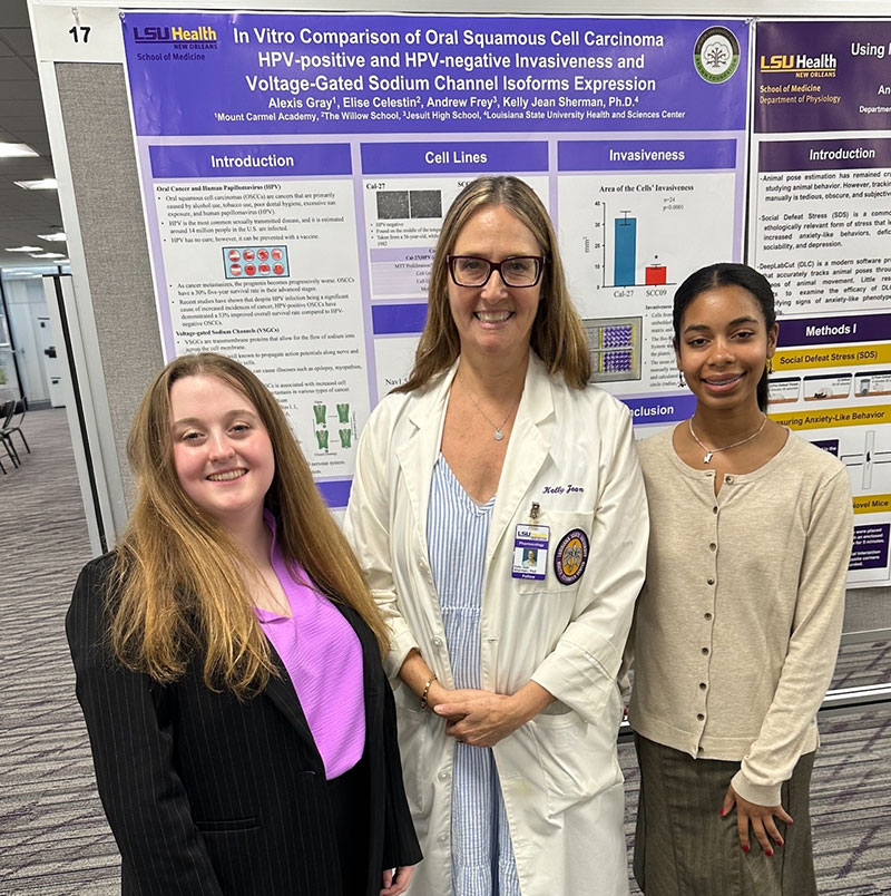 Dr. Kelly Jean Sherman with high school summer interns presenting their cancer research poster at LSU Health New Orleans, part of the LSU LCMC Health Cancer Center mentorship program.