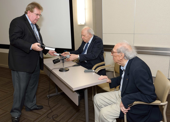 Nelson presenting the awards to Fisher and Friedmann