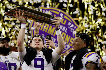 LSU Tigers quarterback lifting the trophy