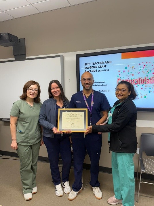 Dr. Balakrishnan accepts award