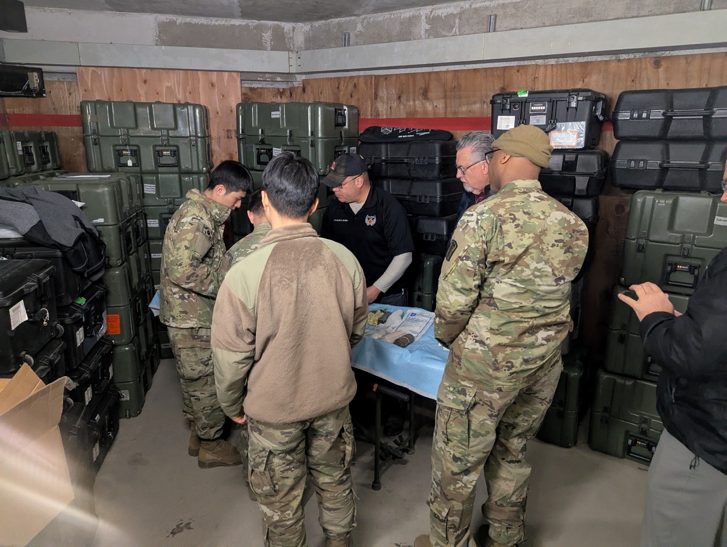 LTC (Ret.) Mario Rivera and Dr. James Johnson conduct a hands‑on burn wound education demonstration for enlisted Republic of Korea Army personnel. 