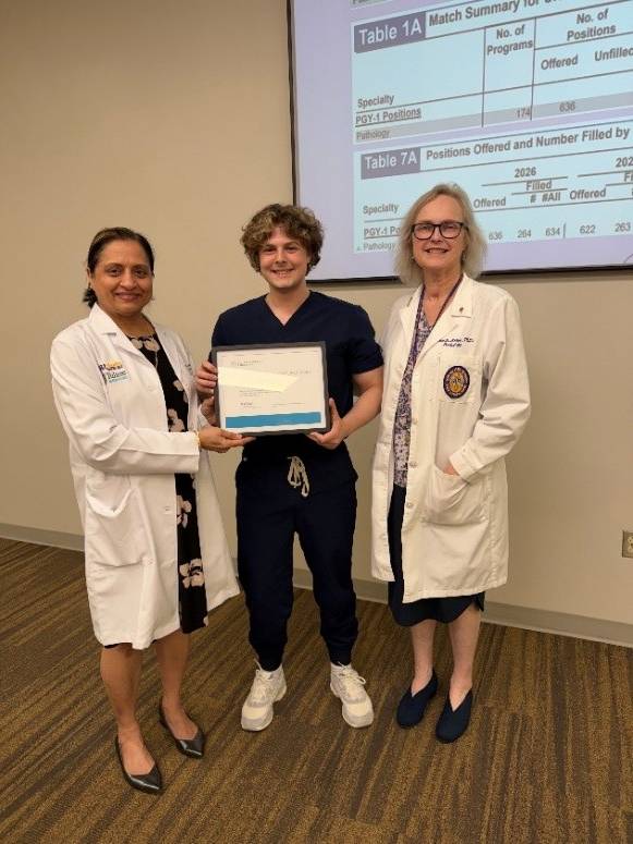 Carson Hebert receives pathlogy award.